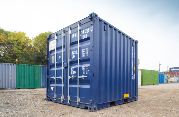 Blue 10ft shipping container with closed double doors, corner castings, and painted weight specification markings.