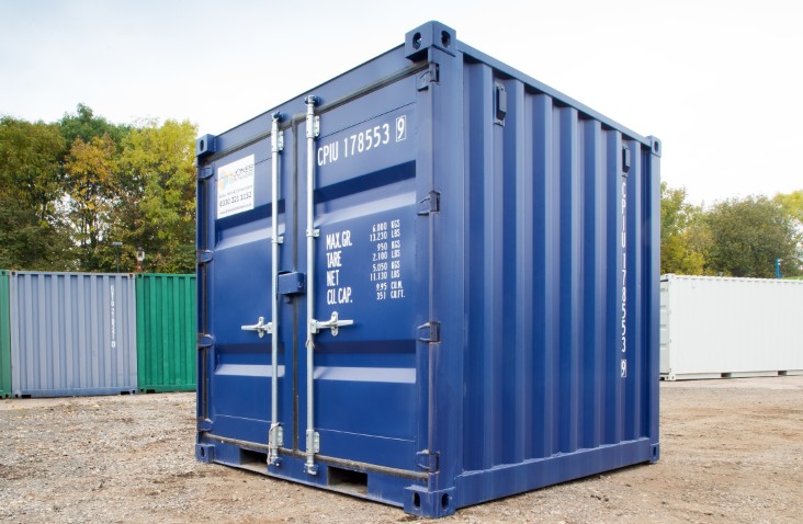 New 8ft blue shipping container with both doors open, showing clean white interior and plywood flooring