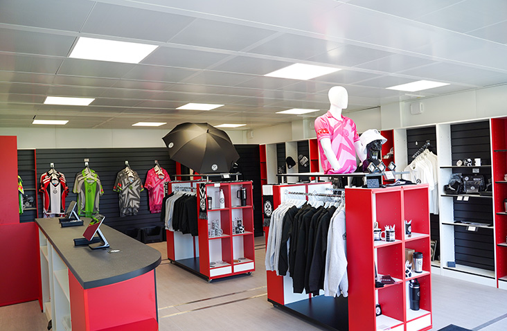 Modular hospitality and pop-up retail unit with shop fittings, display shelving and branded merchandise for events and commercial use.