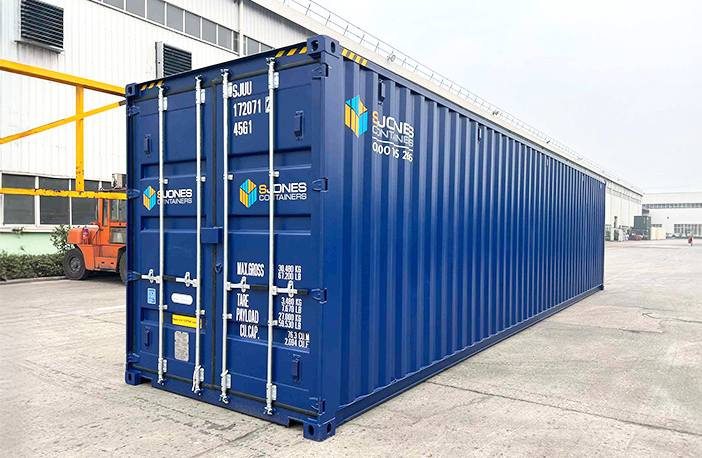 Blue 40ft high cube shipping container offering extra height for large-volume storage or transport, shown on an industrial site
