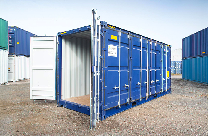     Blue 40ft high cube side opening shipping container with cargo doors open, showing the clean interior and wooden flooring, positioned in a container yard with other units in the background. 