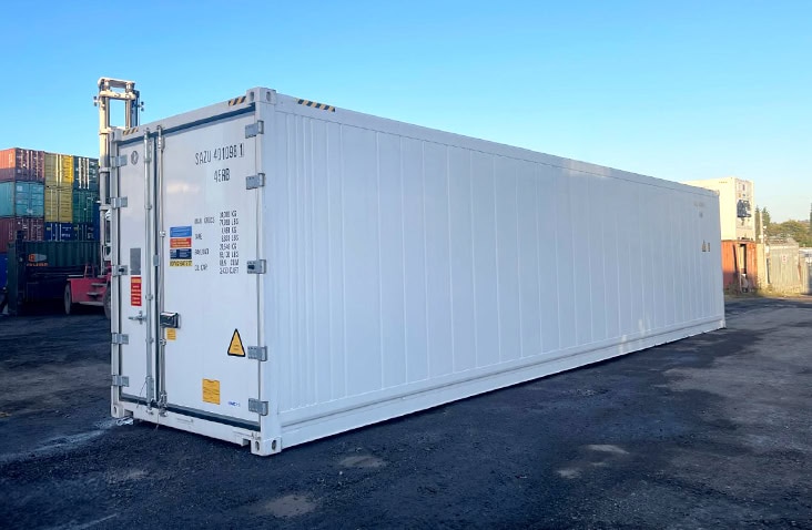 Side profile view of a 40ft white refrigerated container, showing full-length smooth exterior insulated wall panels and container identification markings. 