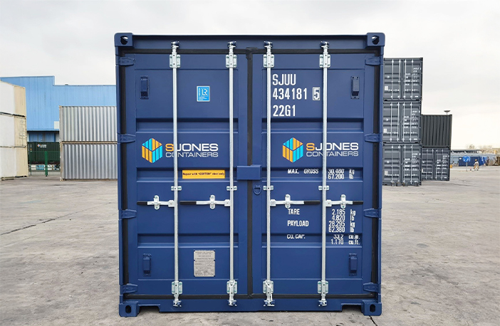 Front of a blue 20ft shipping container with closed double doors, locking bars and S Jones Containers branding
