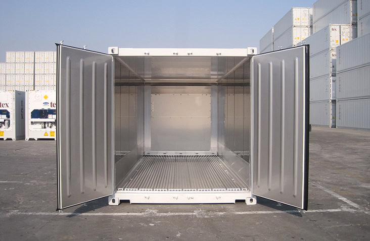 Open 20ft refrigerated shipping container with both doors wide open, showing the clean stainless-steel interior and grooved aluminium floor for airflow. 
