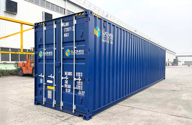 Blue 40ft high cube shipping container offering extra height for large-volume storage or transport, shown on an industrial site. 