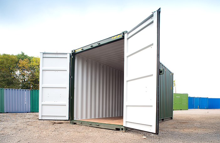 Open 20ft high cube shipping container in green, showing spacious interior with plywood flooring, ideal for storage or transport use.