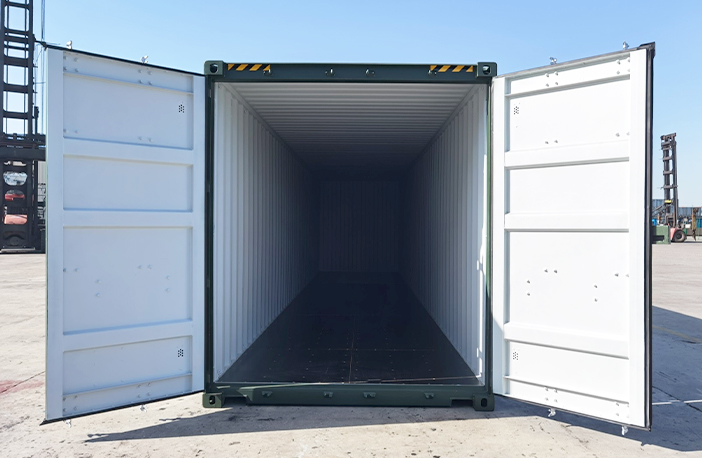 Open 40ft high cube shipping container in green, showing spacious interior and tall ceiling, ideal for large storage or shipping requirements.