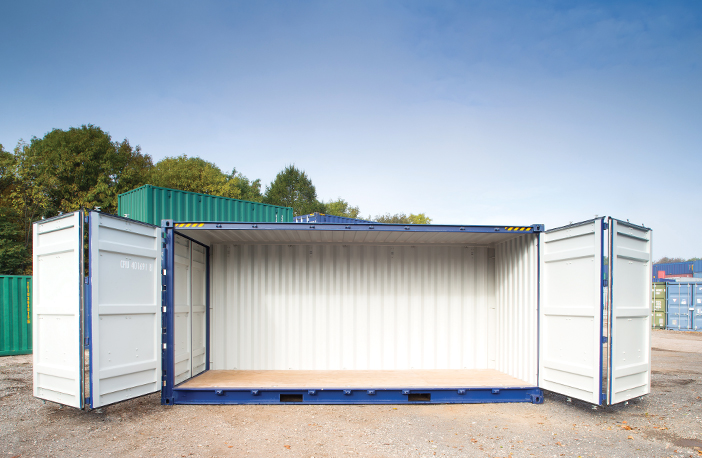     Blue 40ft high cube side opening shipping container with both side doors fully open, revealing the spacious interior and wooden flooring, positioned on a gravel surface in a storage yard with other containers nearby. 