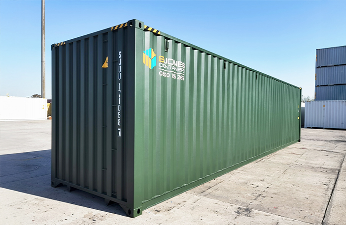 Rear view of a green 40ft high cube shipping container, designed for extra storage capacity and secure, weatherproof performance.