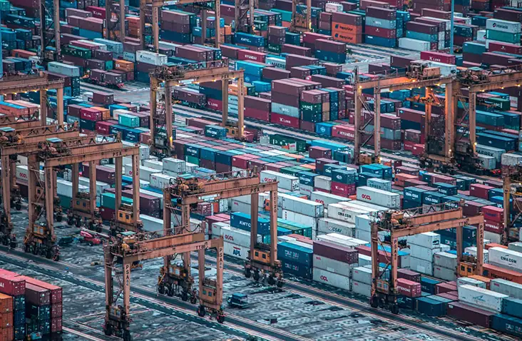 A close up aerial shot of a dockyard full of shipping containers