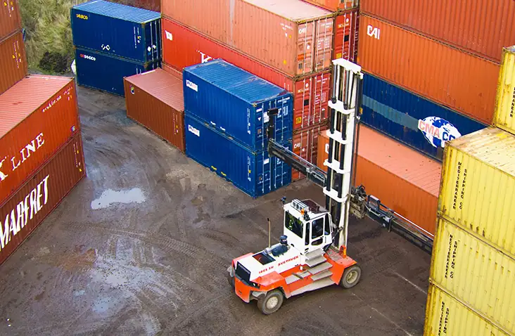 Shipping containers being moved via a ground vehicle