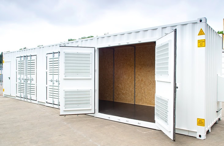 Insulated shipping container with OSB lining, anti-slip flooring and louvred ventilation panels, shown with open double doors.