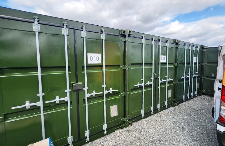 Green shipping containers with a clean, restored finish following ClearRestore® paint rejuvenation. 
