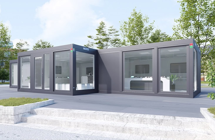 Modern modular building formed from linked prefabricated units, featuring large glazed windows and contemporary finishes, demonstrating flexible modular construction for commercial and public sector use.