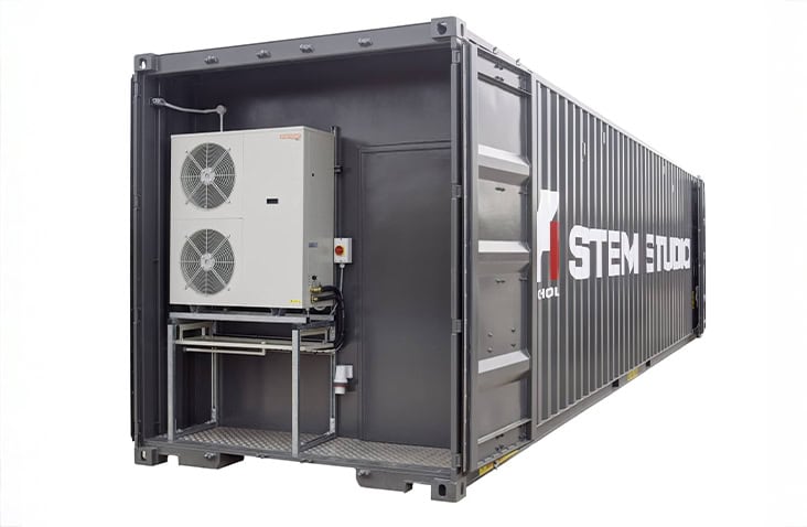 40ft shipping container converted into a climate-controlled STEM workshop, fitted with external HVAC system, personnel door and steel access platform for education and technical training use. 