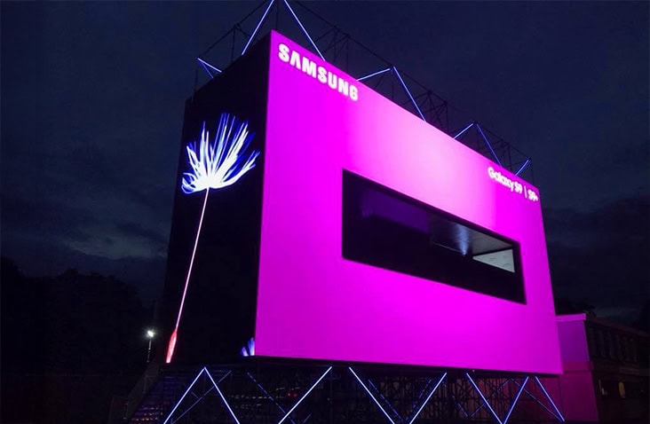 Samsung Galaxy S9 experiential marketing container illuminated at night, featuring a branded LED exterior and integrated viewing window within a custom container conversion. 