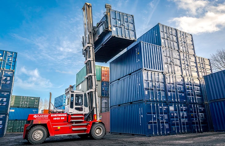 Rows of shipping containers at the S Jones depot, showcasing a wide range of container sizes and types available, helping customers find the perfect shipping container for storage, conversion, or hire.  