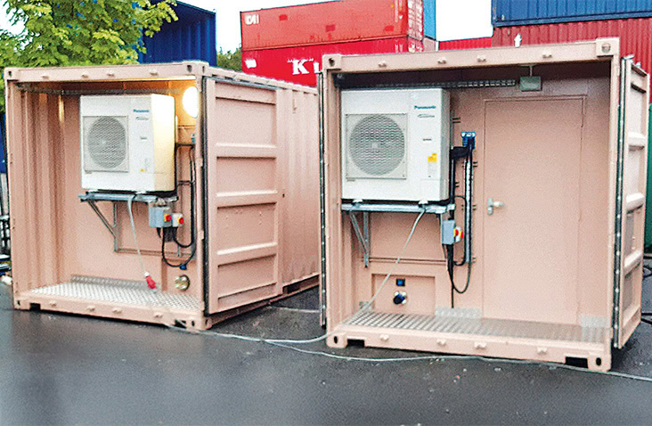 Two 20ft shipping containers converted into water treatment units, showing internal HVAC equipment, electrical controls, and chequer plate flooring inside open containers at an industrial site. 