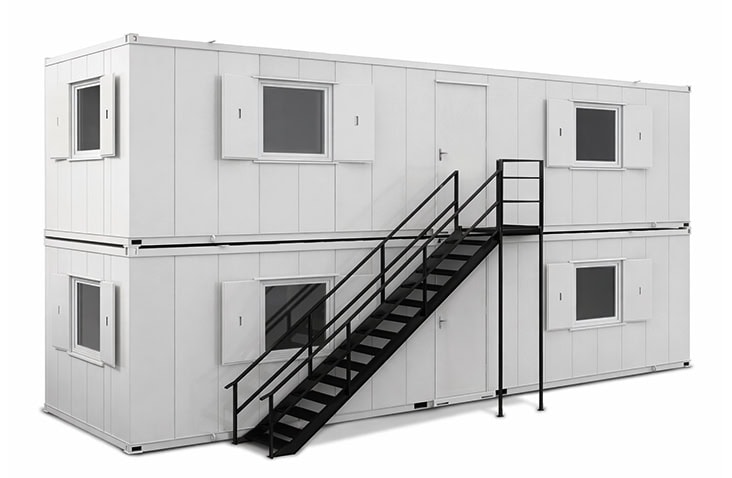 Two-storey white modular site accommodation units stacked with an external black steel staircase, featuring multiple windows and access doors, designed for temporary site accommodation hire on construction and infrastructure projects. 